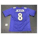 Autographed Lamar Jackson Jersey.