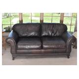 Brown Leather Couch with Rolled Arms and Carved