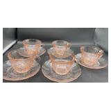 Pink depression, tea, cups, and saucers