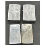 Four vintage zippo lighters