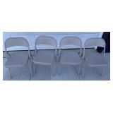 Four metal fold up chairs