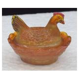 Orange miniature slag glass hen on nest