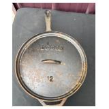 Lodge number 12 cast-iron deep skillet with lid