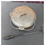 Stansport cast-iron Dutch oven with utensil