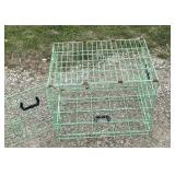Green metal animal cage