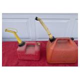 Two gas cans, some gas, not much