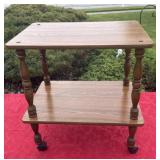 Wooden  table on wheels  24ï¿½ w 25ï¿½ tall