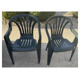 2 green plastic lawn chairs