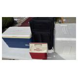 Three coolers and a suit case
