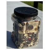 Large plastic container of vintage buttons