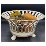 Porcelain centerpiece with artificial fruit
