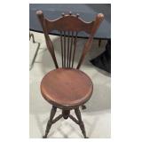 Vintage wooden piano chair with glass claw feet