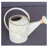 Vintage metal watering can for flower planter