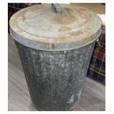 Vintage metal trashcan does have some dents