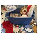 Large plastic tote full of Christmas decorations
