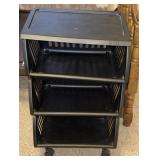 Three plastic shelves on wheels