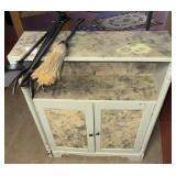 Small cabinet with fireplace utensils