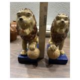 Pair lion w ball pottery bookends 8" tall