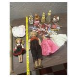 All on table dolls accessories firgual bottles etc