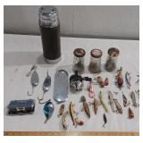 Old fishing lures binoculars thermos reel