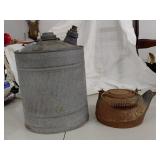 Antique cast iron kettle + vintage gas can