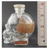 Crystal skull bottle w poison labels
