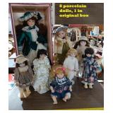 8 porcelain dolls 1 orig box 5 stands