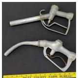 2 vintage gas pump nozzles both signed