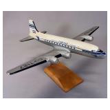 Collectible scale model of a Compañía Cubana de Aviación Douglas DC-4 airliner, featuring a classic silver and white livery with the registration CU-T127