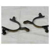 Lot of Black and Gold Spurs