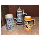 Alaskan stein with pewter top, St. Louis stein, etc.