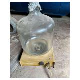 Corning glass jug with spout on metal platform