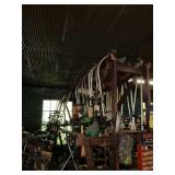 Large assortment of used weed eaters, weed eater parts, tire tubes, etc.