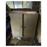 Vintage metal parts cabinet on legs with contents, dent in top