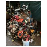 LARGE pile of used chainsaws, parts, weed eaters and parts