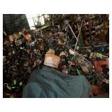 Large collection of used chainsaw pieces and parts