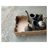 Vintage metal funnels and oil cans