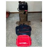 2 rolling suitcases and duffle bags