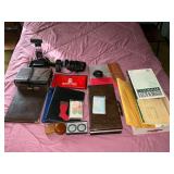 Office supplies, desk lamp, ledger paper, etc.
