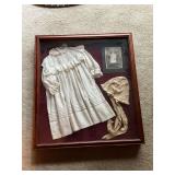 Baptismal gown in shadow box
