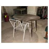 Oval kitchen table with pair of lawn chairs