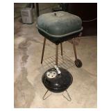 Small Weber charcoal grill 14" W with a regular charcoal grill