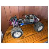 Traxxas gas-powered monster truck chassis with engine and radio receiver