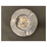 Vintage Chinese coin in ashtray