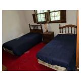 Pair of twin beds, night stand and lamp