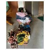 Linens, kitchenware, floral arrangements, cup holder