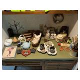 Crock with wooden utensils, teapots, mouse butter dish, wreath