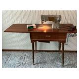Singer sewing machine in cabinet, working condition