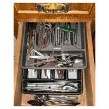 Assorted flatware with Rubbermaid trays