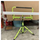 Fluorescent shop light on stand